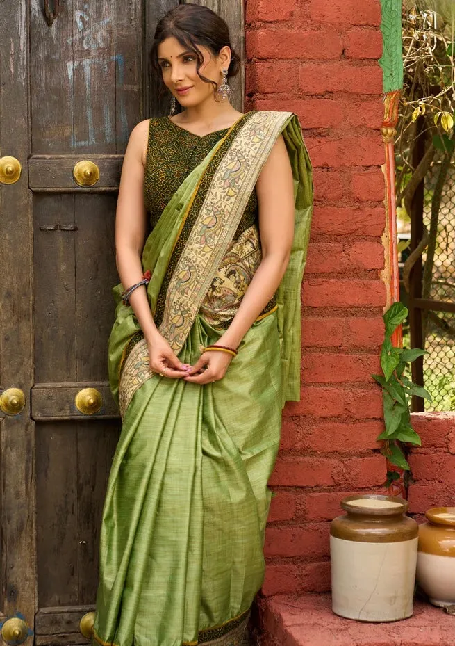 Pastel green semi-silk saree featuring Madhubani artwork on pallu and border