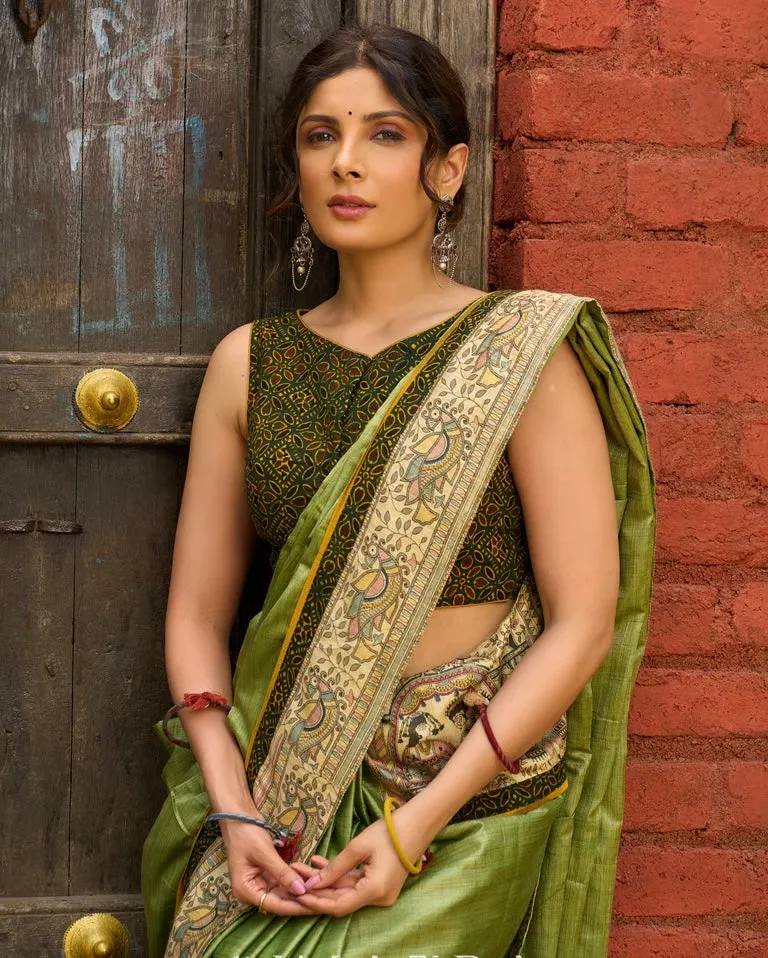 Pastel green semi-silk saree featuring Madhubani artwork on pallu and border