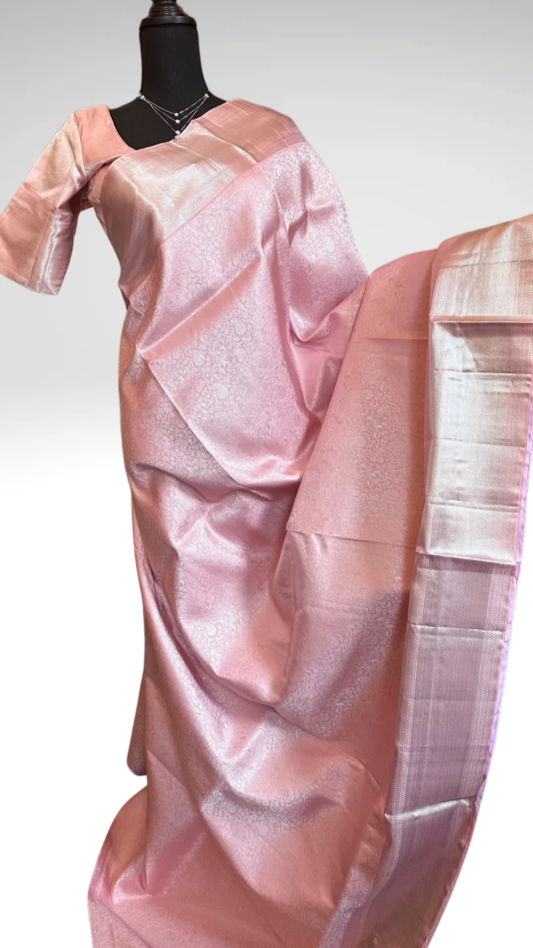 Pastel Pink Brocade kanjivaram silver zari with stitched blouse.