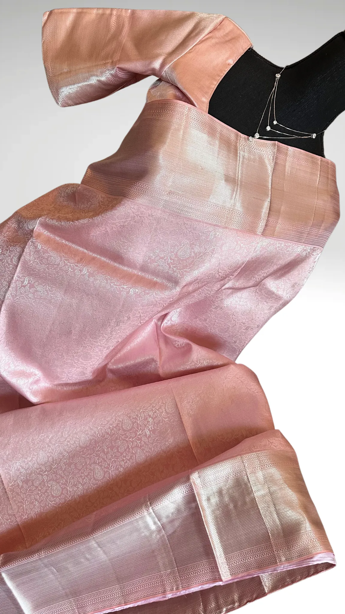 Pastel Pink Brocade kanjivaram silver zari with stitched blouse.