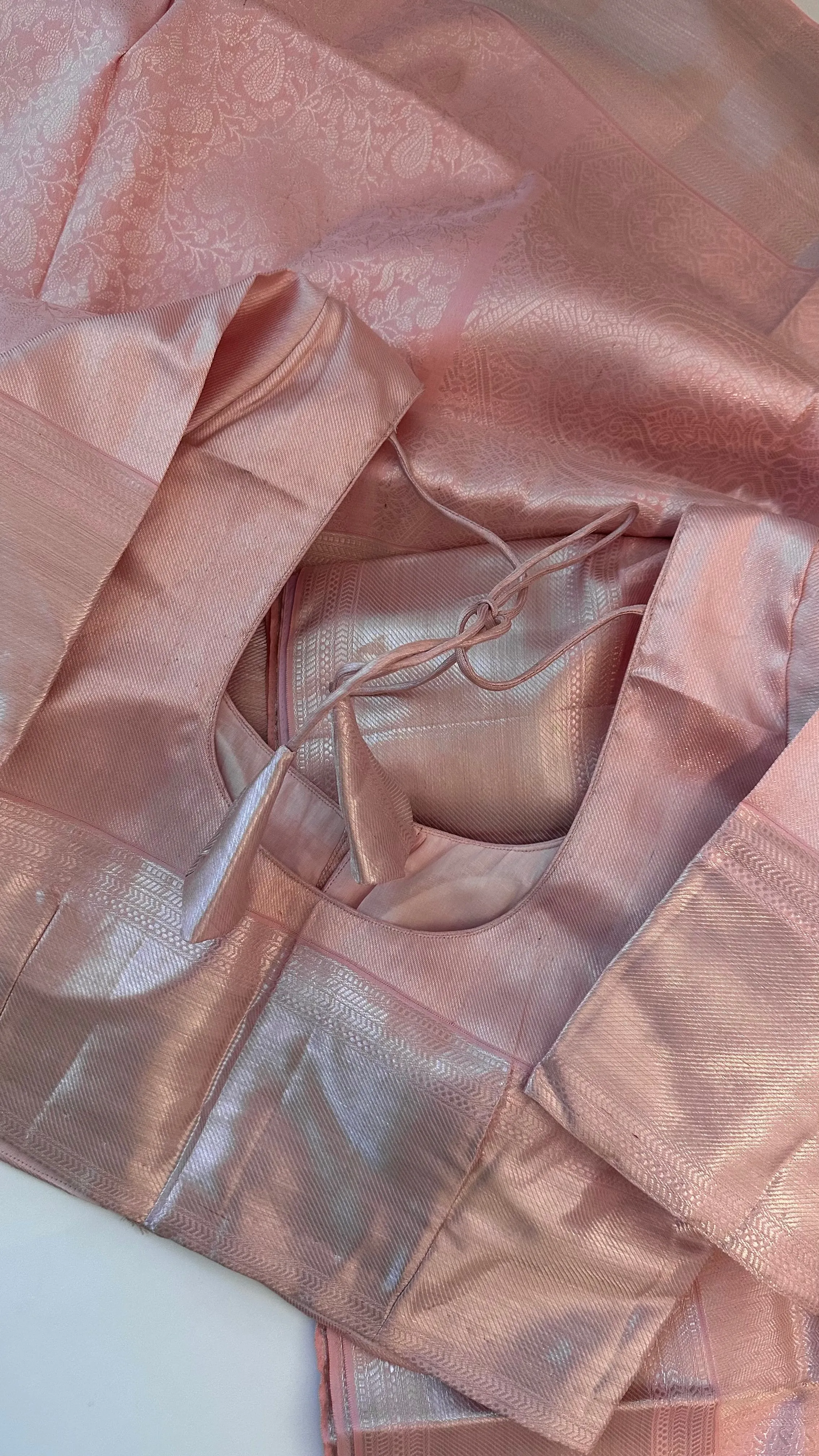 Pastel Pink Brocade kanjivaram silver zari with stitched blouse.